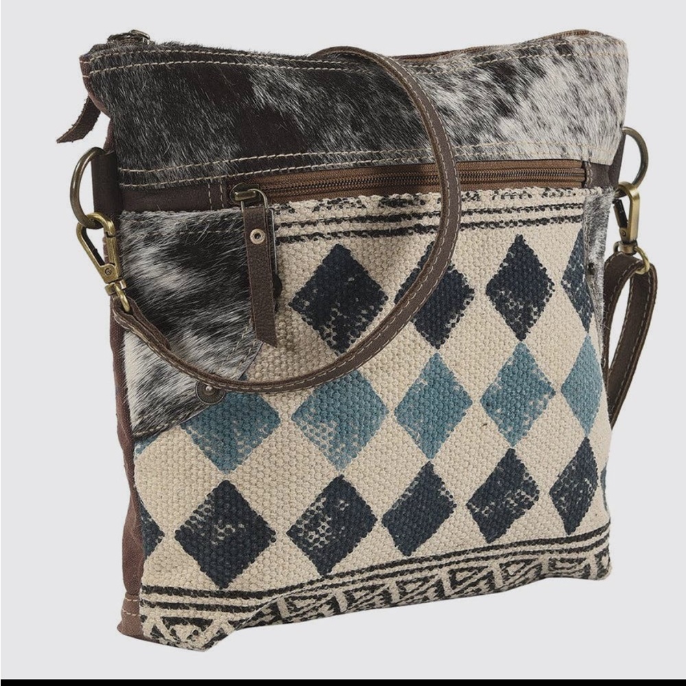 New from our boutique!! The beautiful Lanny hair on hide cross body purse!!